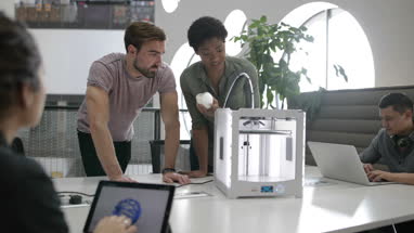 Team working with 3D printer