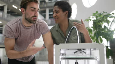 Team working with 3D printer