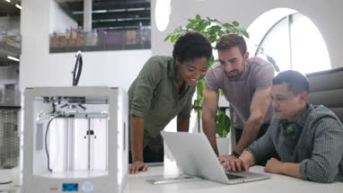 Team working with 3D printer