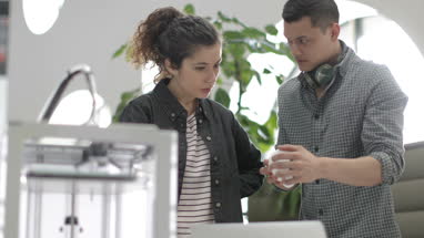 Team working with 3D printer