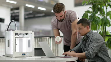 Team working with 3D printer
