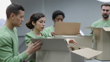 Volunteers sorting clothes donations 