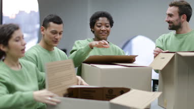 Volunteers sorting clothes donations 