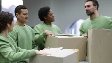 Volunteers sorting clothes donations 