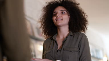 Millennial buying a record in a store