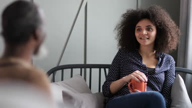 Daughter taking with Father at home