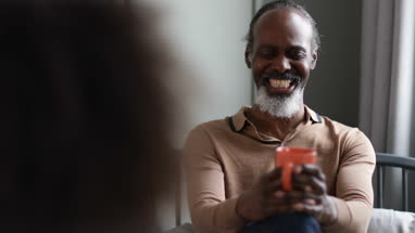 Senior male having coffee with a friend
