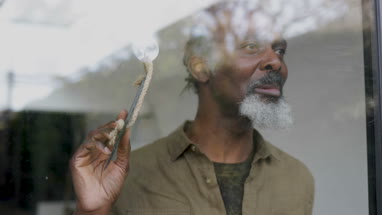 Senior small business owner opening store