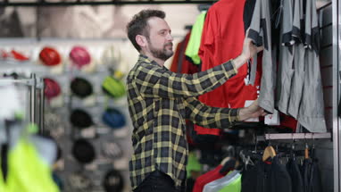 Adult male looking at sportswear in store
