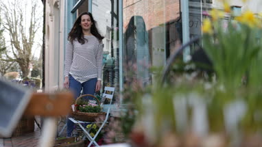 Portrait of a florist outside store
