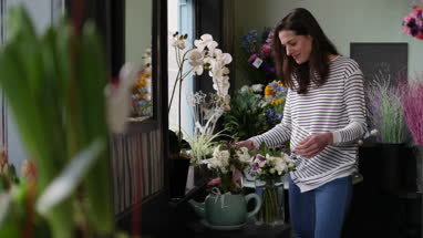 Portrait of a female florist in her store