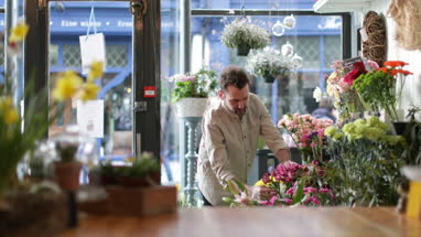 Male Florist working in store