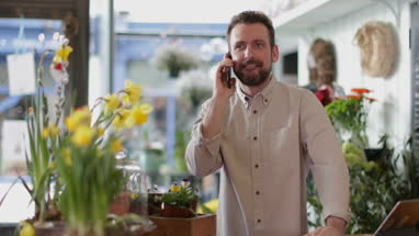 Small business owner taking a customer order in a florist
