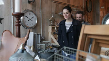 Couple looking shopping in vintage antique store