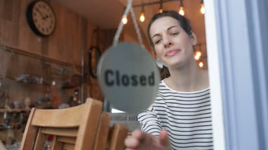 Small business owner opening store