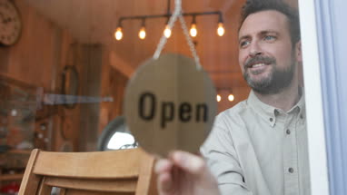Small business owner opening store