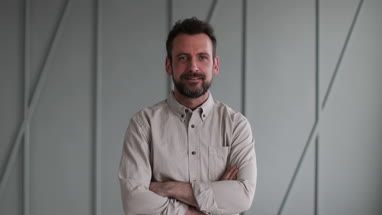 Testimonial portrait of mid adult male looking to camera