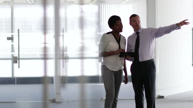 Business colleagues looking at new office space