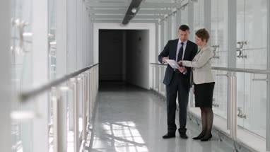 Business people having meeting in modern office using digital tablet