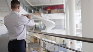 Businessman taking photo of new office space
