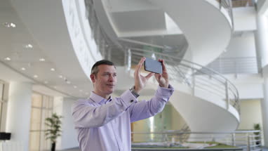 Businessman taking photo of new office space