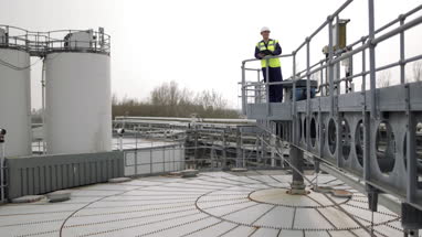 Industrial worker using a digital tablet on site