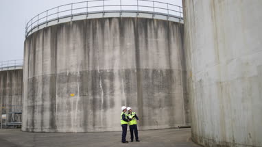 Industrial workers using a digital tablet on site