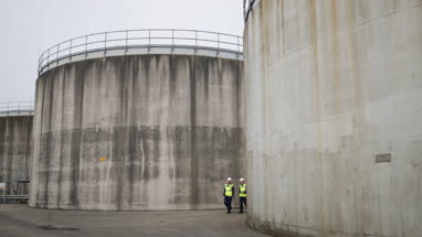 Industrial workers using a digital tablet on site