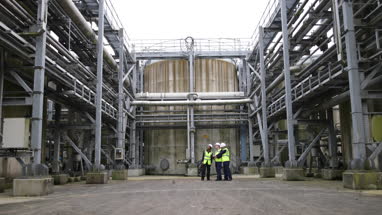 Industrial workers using a digital tablet on site