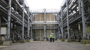 Industrial workers using a digital tablet on site