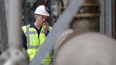 Industrial worker using radio on site