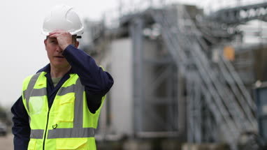 Mature industrial worker starting work