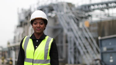 Portrait of female industrial worker on site