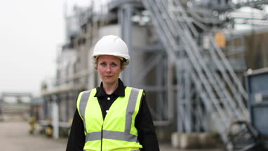 Portrait of female industrial worker on site