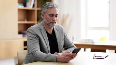 Portrait of businessman at desk