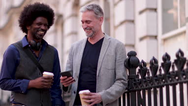 Male friends outdoors in city