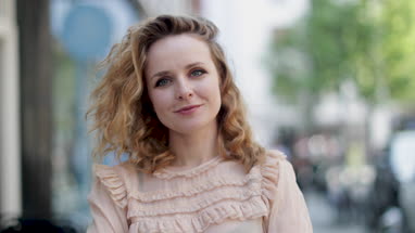 Portrait of adult female outdoors in city