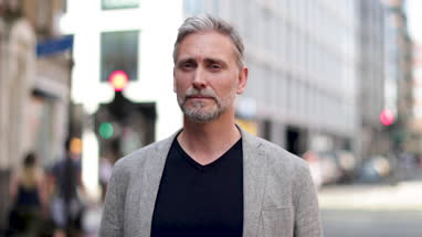 Portrait of mature male outdoors in city