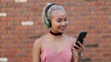 Young adult female streaming music