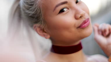 Young adult female taking selfie
