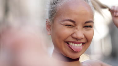 Young adult female taking selfie