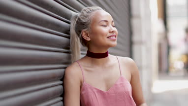 Portrait of young adult female with urban background