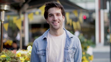 Portrait of young adult male looking to camera