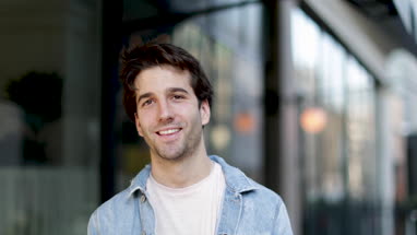 Portrait of young adult male looking to camera