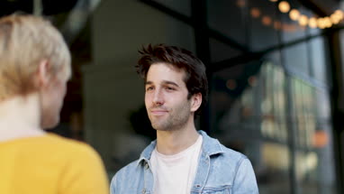 Friends talking outside of bar