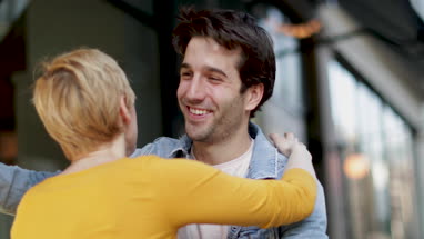 Friends meeting outside bar