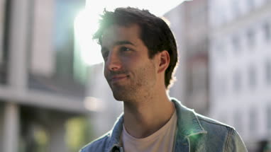 Portrait of young adult male looking to camera