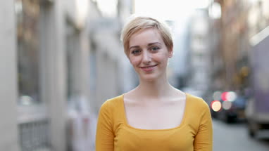 Portrait of young adult female on street