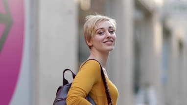 Young adult female walking down street
