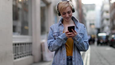 Young adult female streaming music